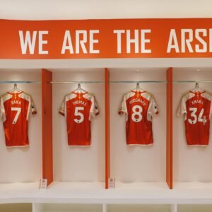 Arsenal FC jerseys on display in the Emirates Stadium locker room, London.